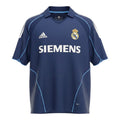 Hinchas Sportswear Store navy blue Real Madrid 2005-06 away jersey with white Adidas stripes and light blue piping. Features Siemens sponsor and V-neck polo collar.