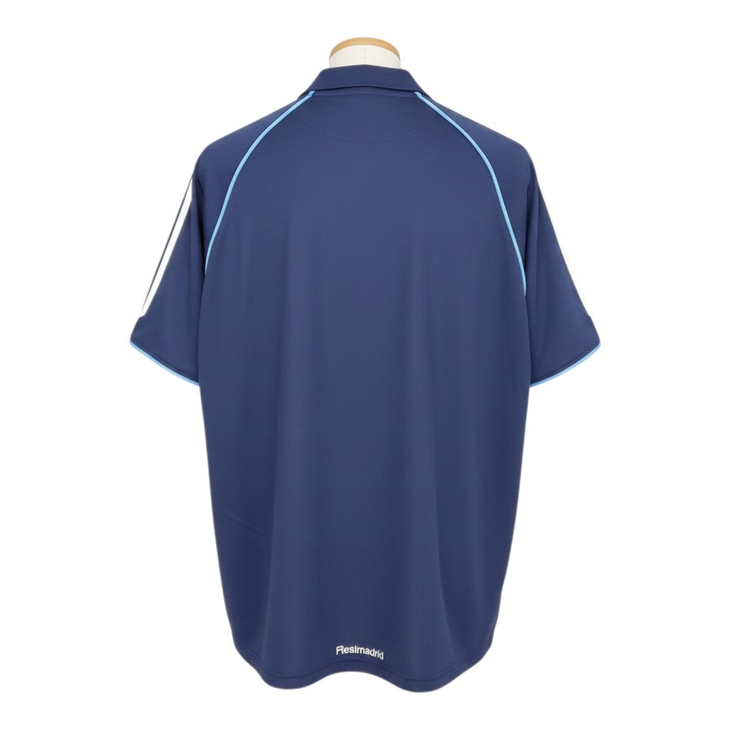 Hinchas Sportswear Store navy blue Real Madrid 2005-06 away jersey with white Adidas stripes and light blue piping. Features a polo collar and Climacool technology.