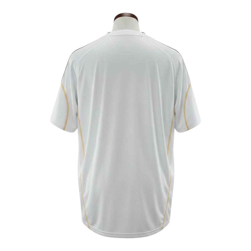 Hinchas Sportswear Store white Adidas Real Madrid 2009-10 retro jersey with gold piping and black stripes.