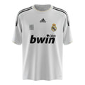 Hinchas Sportswear Store white Adidas Real Madrid 2009-10 retro jersey with black stripes, gold piping, bwin sponsor, and Climacool tech.
