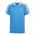 Hinchas Sportswear Store Real Madrid retro sky blue jersey with white pinstripes, white collar, and Adidas Originals branding.