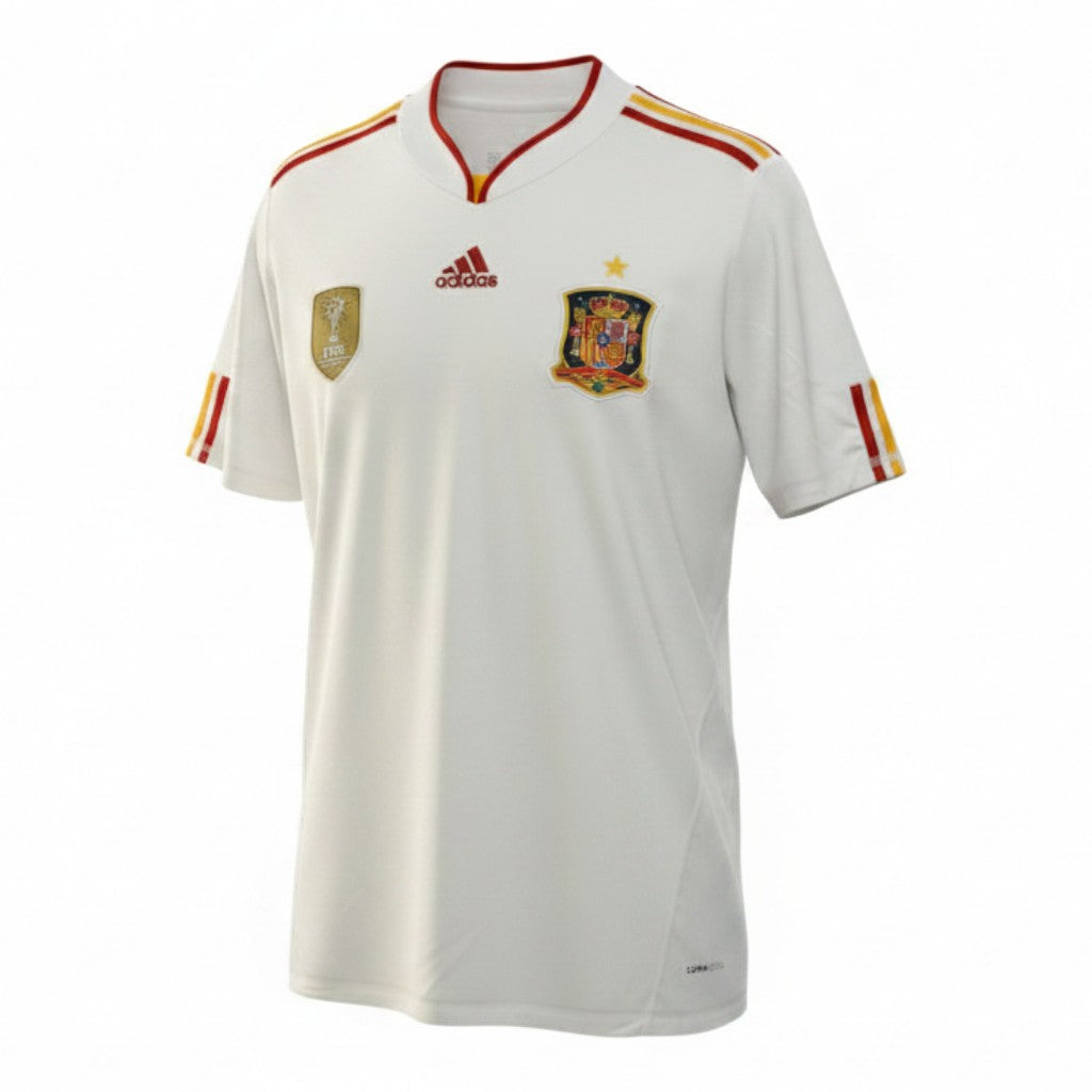 Hinchas Sportswear Store white Adidas Spain 2010 World Cup away jersey with red and yellow trim, crest, and FIFA Champions badge.