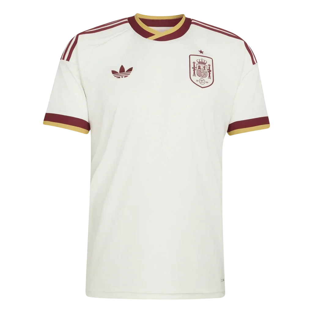Hinchas Sportswear Store Spain 2026 World Cup away jersey. Cream with maroon and gold trim, featuring the official crest and Adidas logo.